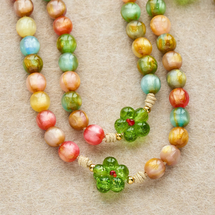 Christianartworkshop Rosenkranz aus grünem Glas und Pastellfarben mit Katzenaugenmotiv und Marienkreuz - image 6