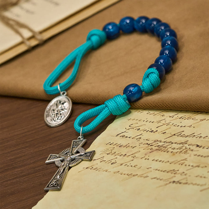Christianartworkshop Rosenkranz mit marineblauen Perlen und türkisfarbener Kordel, verziert mit dem Heiligen Michael - image 2