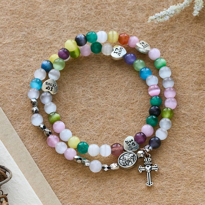 Christianartworkshop Mehrfarbiges Katzenaugen-Perlenarmband (Halskette für Kinder) mit „Ich liebe Jesus“- und Erzengel-Medaillen - Kreuz- und Engelsmedaille - image 0