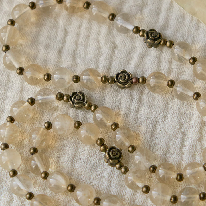 Christianartworkshop Rosenkranz aus bernsteinfarbenen Glasperlen mit Kamelienverzierungen: Ein Symbol für Christi Licht und Reinheit - image 4