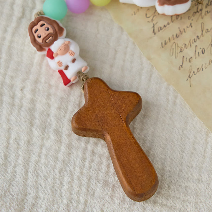 Christianartworkshop Rosenkranz aus pastellfarbenen Silikonperlen mit Jesus-Motiven: Ein Symbol kindlichen Glaubens und göttlicher Freude - image 5