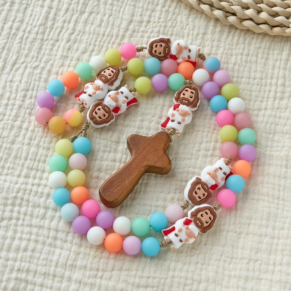 Christianartworkshop Rosenkranz aus pastellfarbenen Silikonperlen mit Jesus-Motiven: Ein Symbol kindlichen Glaubens und göttlicher Freude - image 2