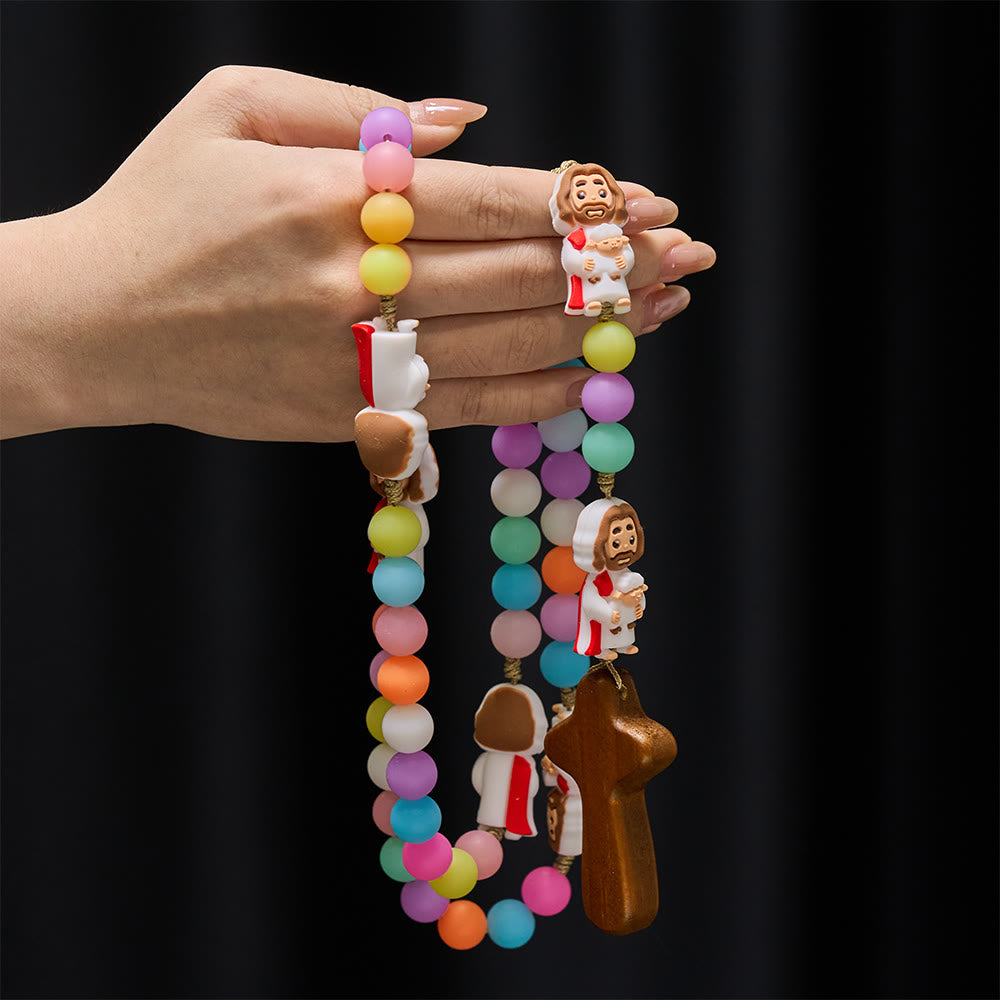 Christianartworkshop Rosenkranz aus pastellfarbenen Silikonperlen mit Jesus-Motiven: Ein Symbol kindlichen Glaubens und göttlicher Freude - image 1