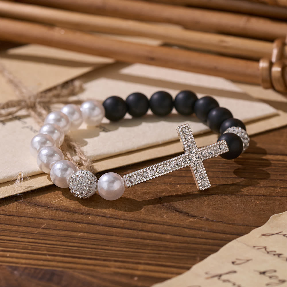 Christianartworkshop Zweiteiliges Armbandset mit weißen und mattschwarzen Perlen in Kreuzform: Symbol göttlicher Reinheit und Erlösung - image 1