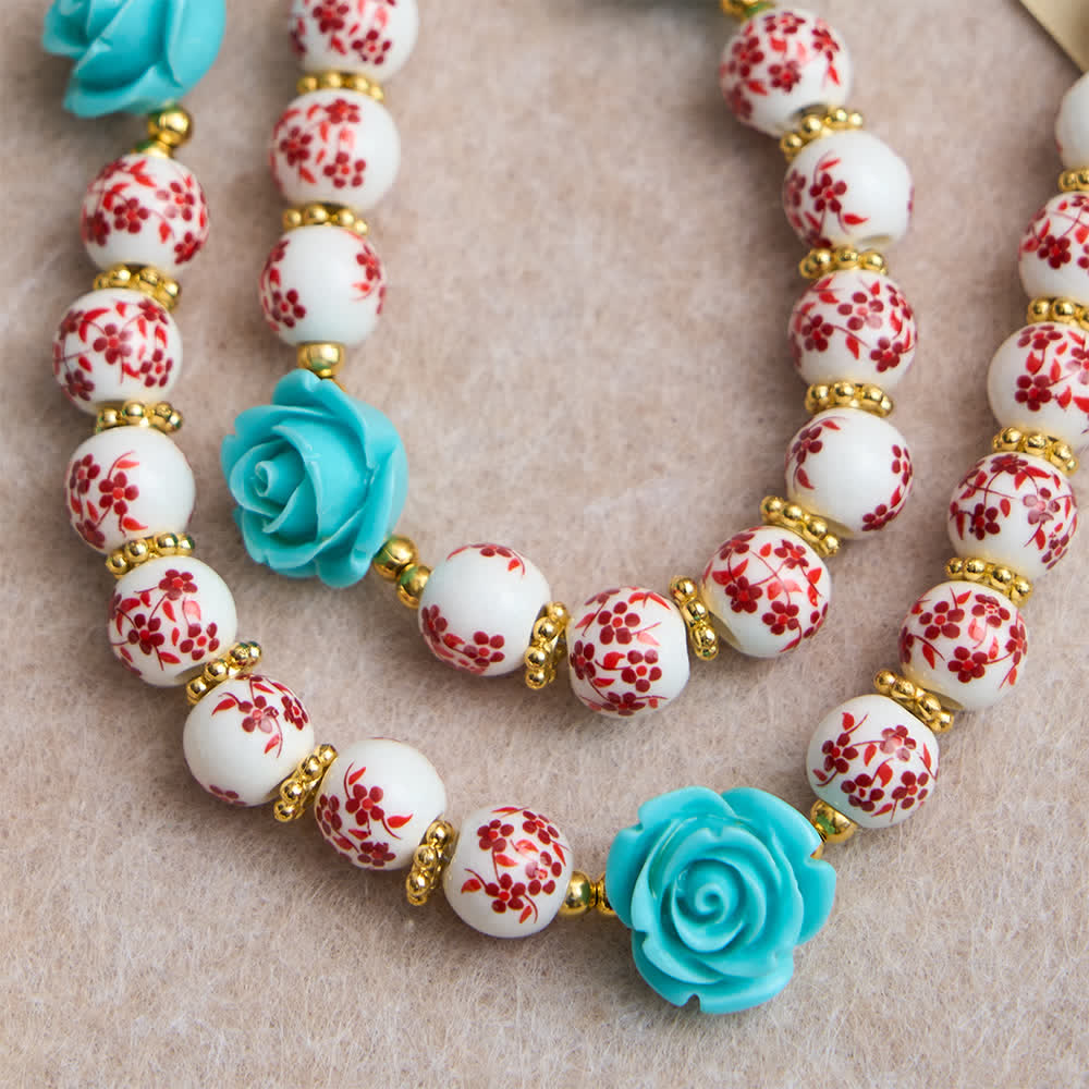 Christianartworkshop Rosenkranz der Sieben Schmerzen mit roter und weißer Keramikperle, türkisfarbener Rose und Marienmedaille - image 5