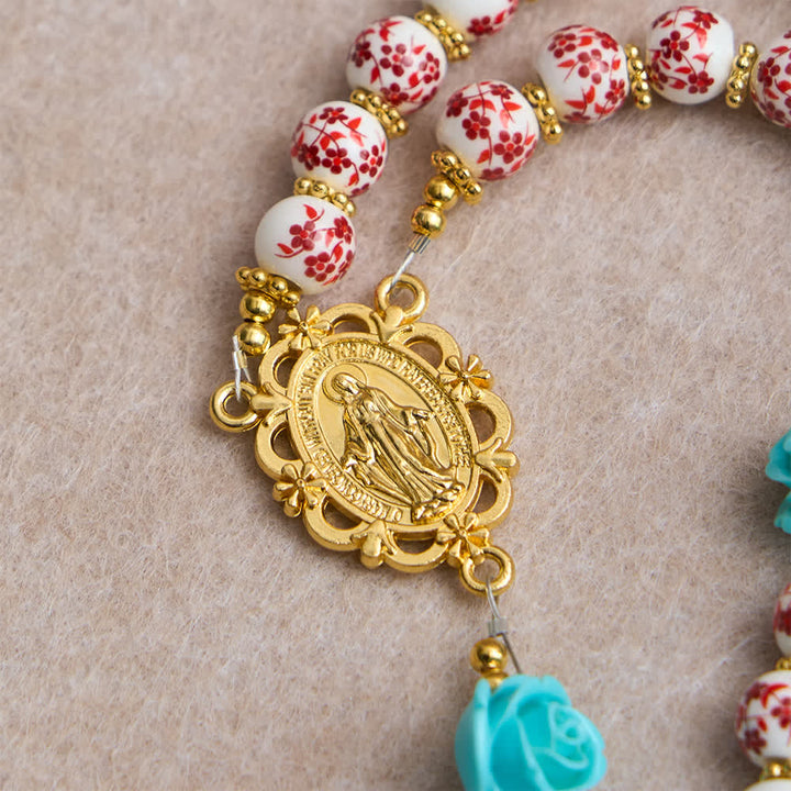 Christianartworkshop Rosenkranz der Sieben Schmerzen mit roter und weißer Keramikperle, türkisfarbener Rose und Marienmedaille - image 7