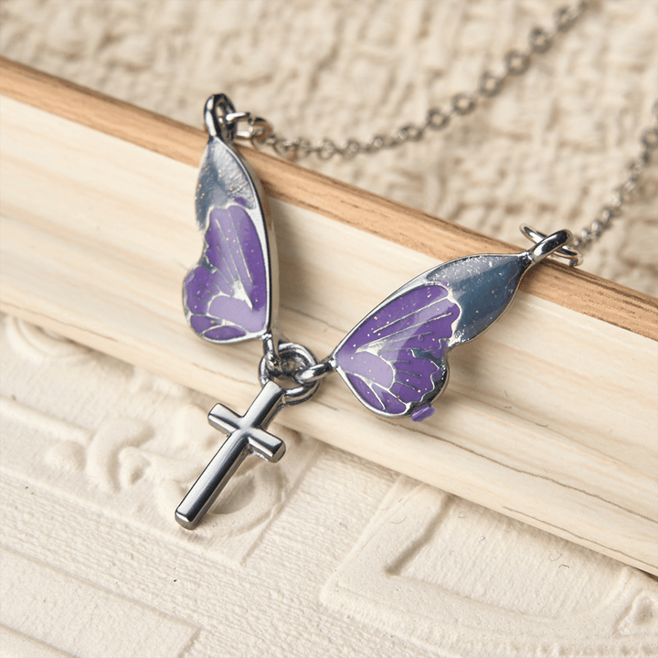 Christianartworkshop Verspielte Schmetterlingsflügel-Kreuz-Halskette: Ein strahlendes Symbol göttlichen Lichts und Hoffnung - Schmetterling & Kreuz - image 0