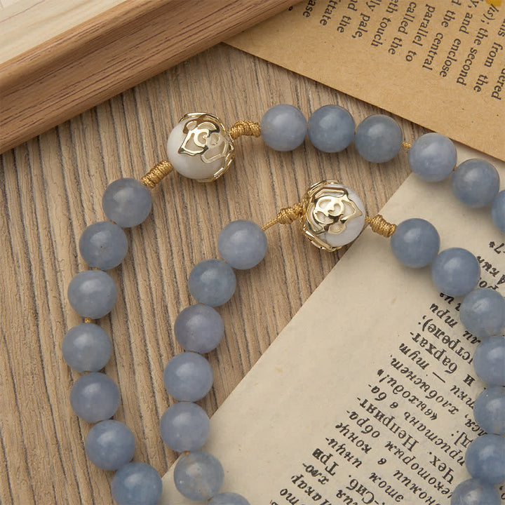 Christianartworkshop Rosenkranz aus Aquamarin und weißem Howlith: Goldene Filigranverzierungen mit dem heiligen Benedikt für heiteren Glauben - image 6