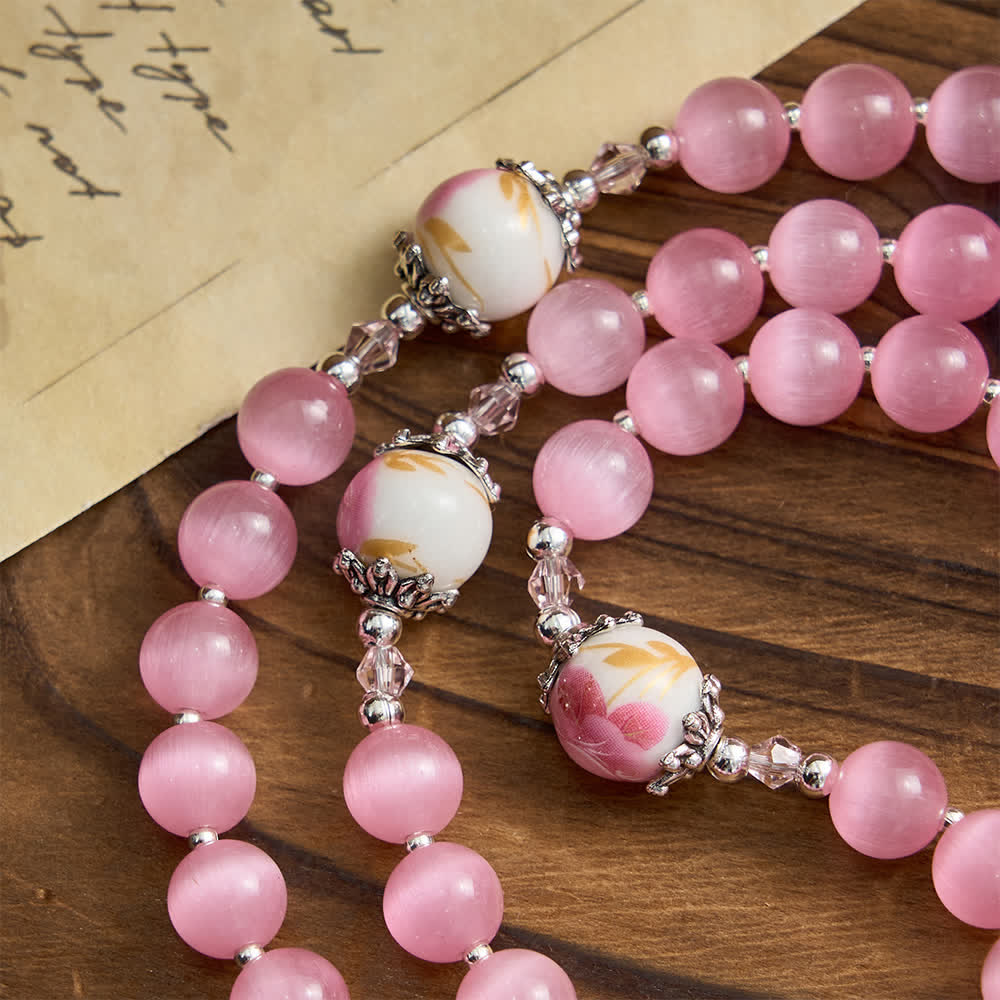 Christianartworkshop Eleganter rosa Rosenkranz mit Katzenaugenmotiv und floralen Marienverehrungsmotiven - image 7