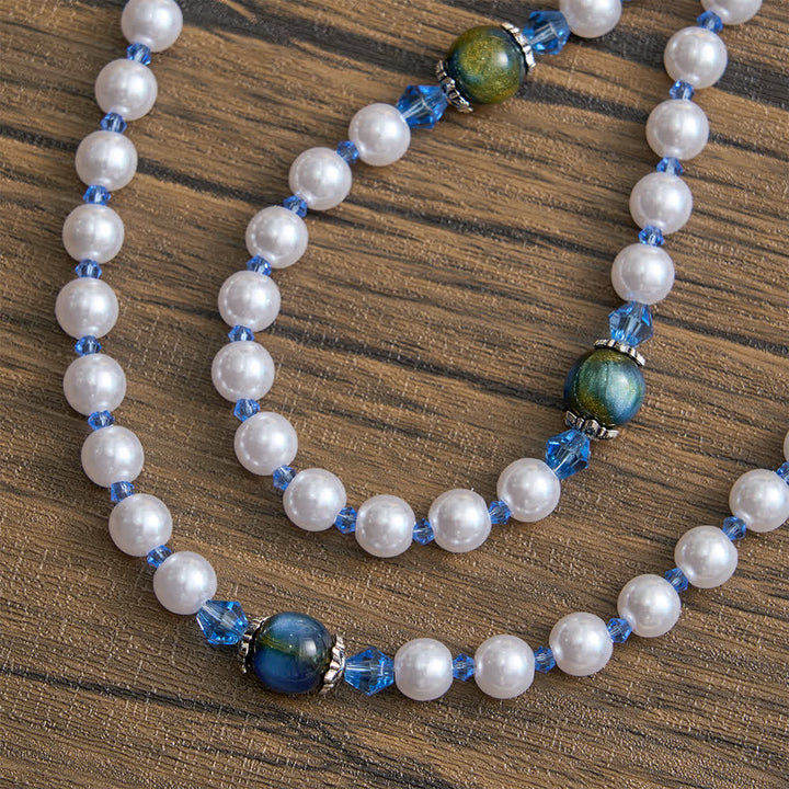 Christianartworkshop Rosenkranz mit blau-grünem Farbverlauf und weißen Perlen und Marienmotiv - image 7