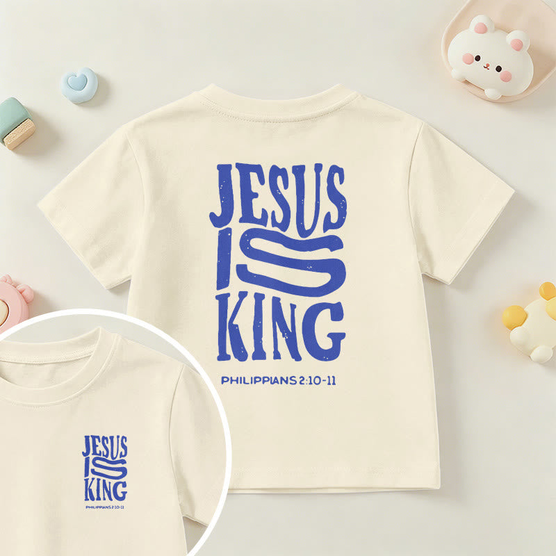 Christianartworkshop „Jesus ist König“ Philipper 2,10-11 Kinder-T-Shirt mit kurzen Ärmeln und auffälligem Aufdruck in abgenutzter, fetter Schrift auf Vorder- und Rückseite - Beige - US/GB/AU 14, EU 170 - image 0