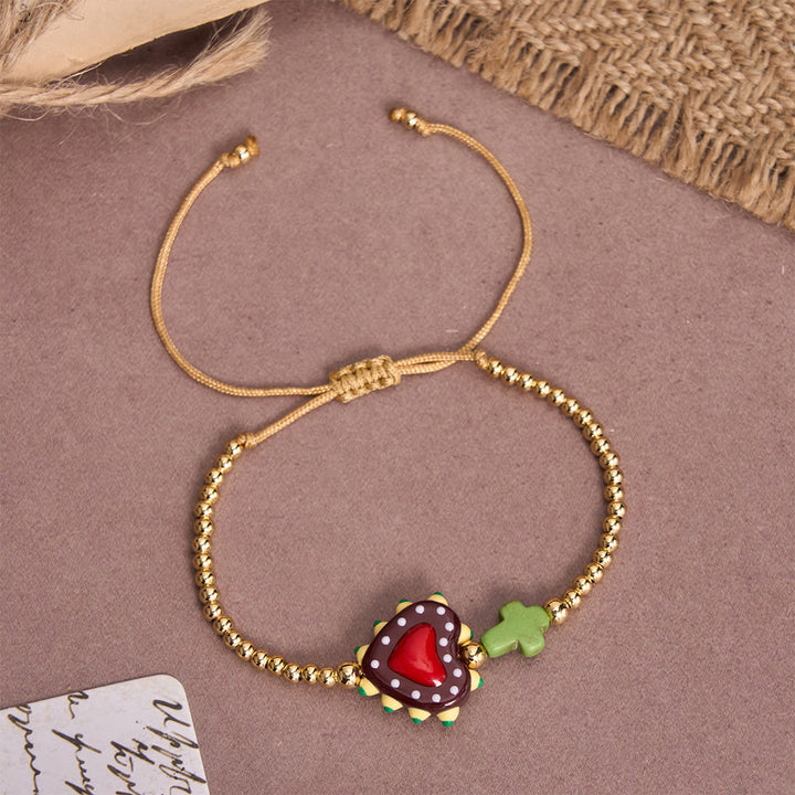 Christianartworkshop Armband im Cartoon-Stil mit handverziertem Herz-Jesu-Motiv und kleinem Kreuz, verziert mit goldenen Perlen und verstellbarer Kordel - D - image 8