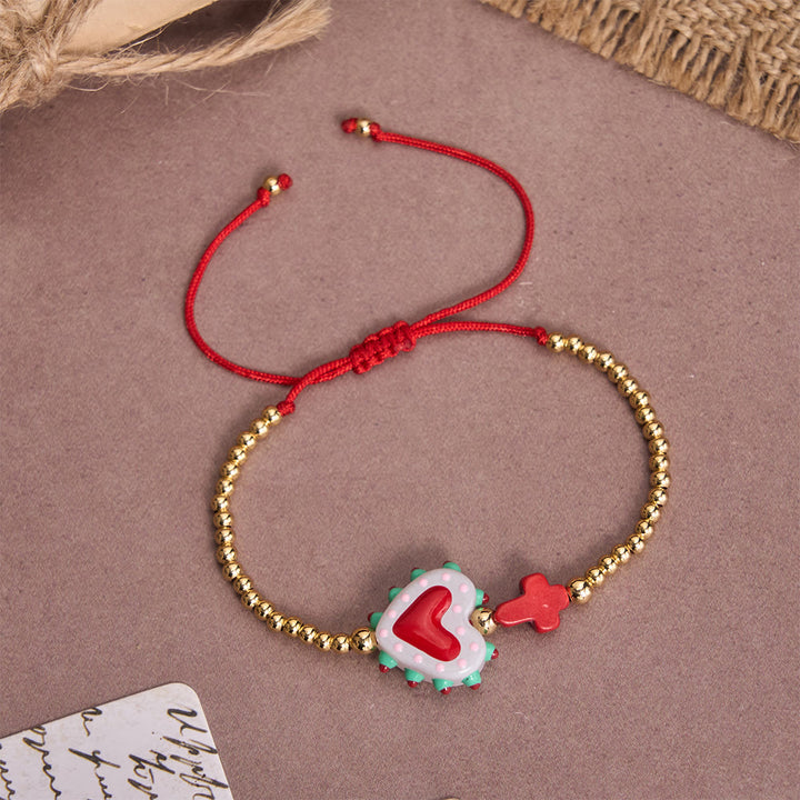 Christianartworkshop Armband im Cartoon-Stil mit handverziertem Herz-Jesu-Motiv und kleinem Kreuz, verziert mit goldenen Perlen und verstellbarer Kordel - E - image 10