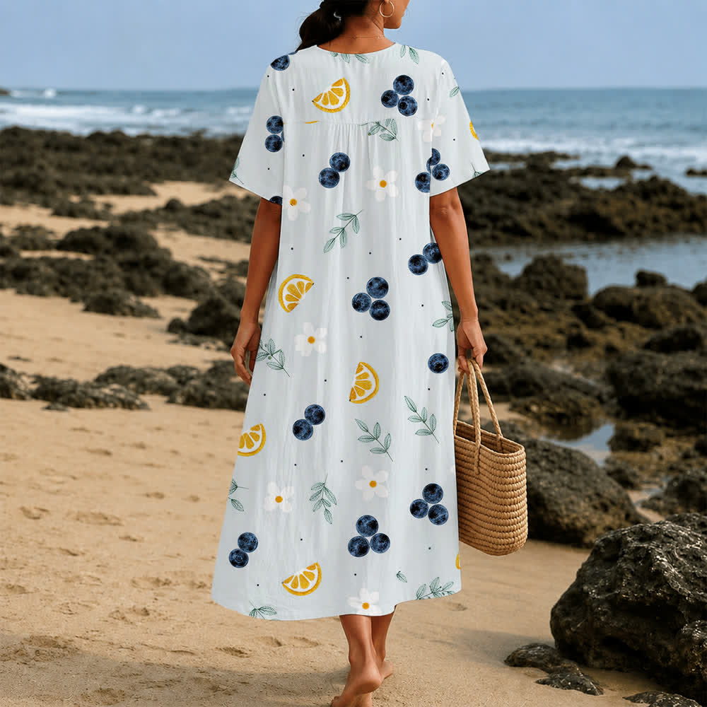 Christianartworkshop Sommerliches Oversize-Midikleid mit Blumenmuster, gekreuztem Grafikprint, V-Ausschnitt und kurzen Ärmeln - image 12