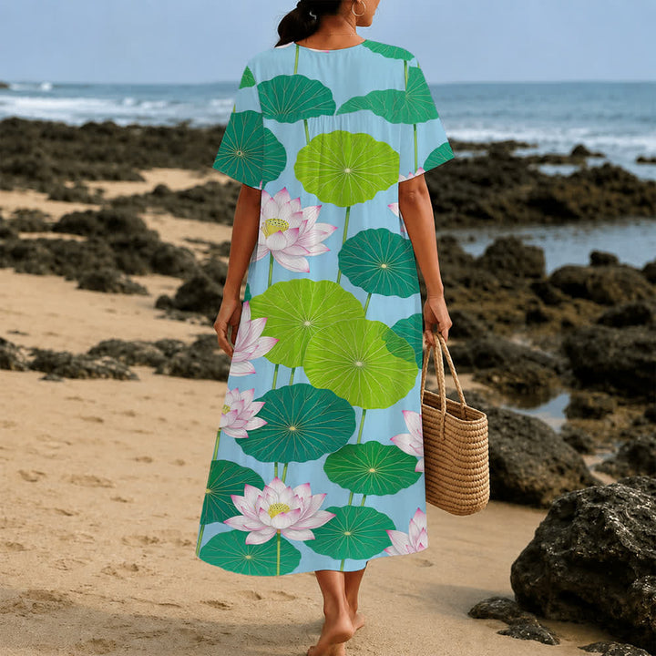 Christianartworkshop Sommerliches Oversize-Midikleid mit Blumenmuster, gekreuztem Grafikprint, V-Ausschnitt und kurzen Ärmeln - image 16