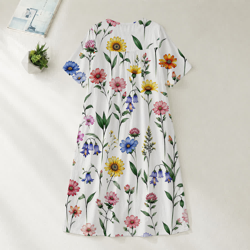 Christianartworkshop Sommerliches Oversize-Midikleid mit Blumenmuster, gekreuztem Grafikprint, V-Ausschnitt und kurzen Ärmeln - image 30