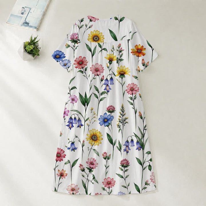 Christianartworkshop Sommerliches Oversize-Midikleid mit Blumenmuster, gekreuztem Grafikprint, V-Ausschnitt und kurzen Ärmeln - image 30