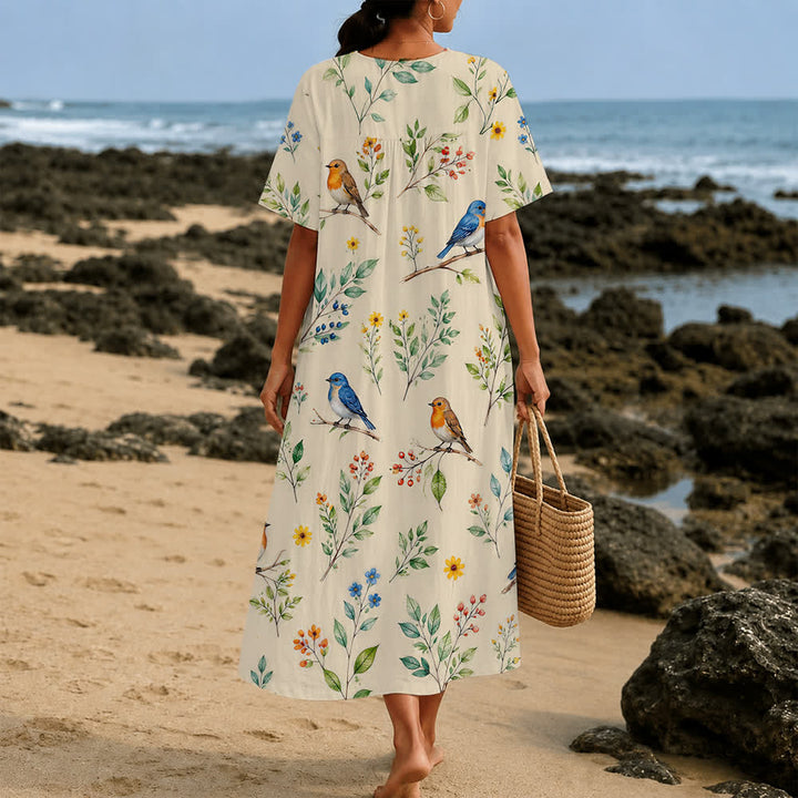 Christianartworkshop Sommerliches Oversize-Midikleid mit Blumenmuster, gekreuztem Grafikprint, V-Ausschnitt und kurzen Ärmeln - image 40