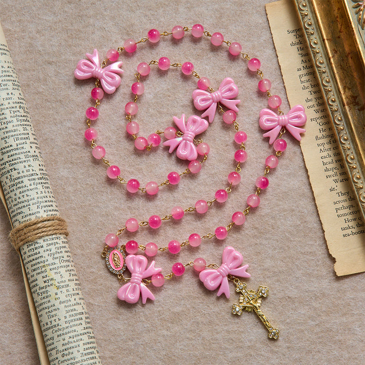 Christianartworkshop Mädchenhafter, zweifarbiger Rosenkranz mit Farbverlauf, glänzenden Harzschleifen und goldenem, juwelenbesetztem Kruzifix - Rosenkranz mit rosa Schleifen - image 0