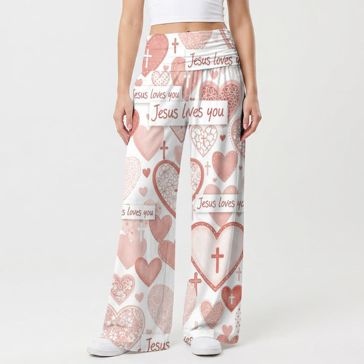 Christianartworkshop Pinkfarbene Damenhose mit weitem Bein und dem Schriftzug „Jesus liebt dich“ mit Herz- und Kreuzmotiv. - image 1