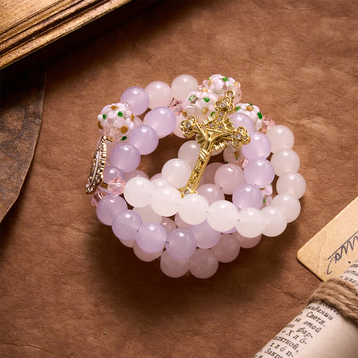 Christianartworkshop Rosenkranz aus Glasperlen mit Farbverlauf in Rosa, Lavendel und Milchweiß, verziert mit Strasskreuz und Marienmedaille - image 4