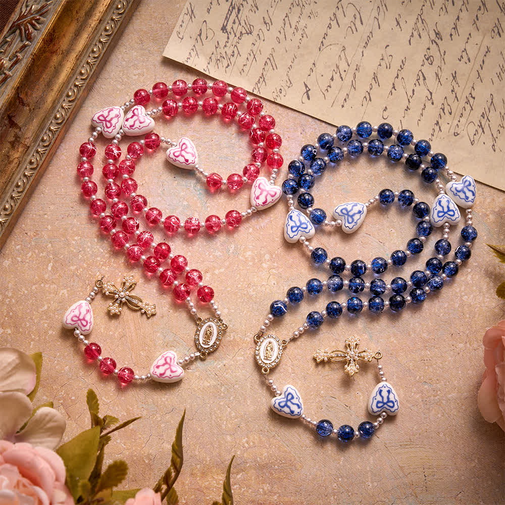 Christianartworkshop Rosenkranz aus blauem Crackle-Glas mit Keramikherz-Schleifenperlen und Marienmedaille - image 1