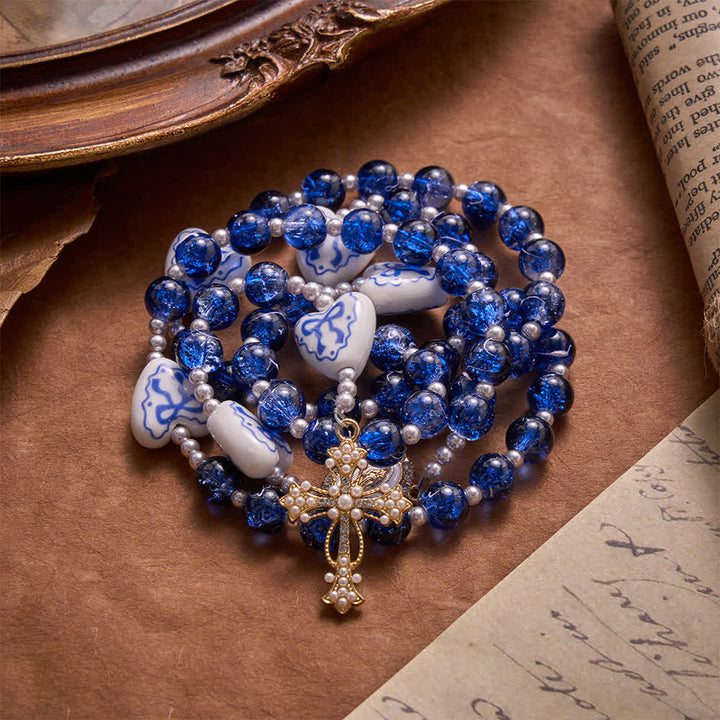 Christianartworkshop Rosenkranz aus blauem Crackle-Glas mit Keramikherz-Schleifenperlen und Marienmedaille - image 7