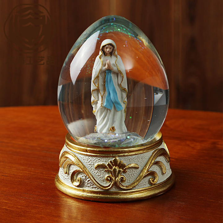 Christianartworkshop Glitzernde Schneekugel in Eiform mit betender Madonna-Statue: Symbol reiner himmlischer Bitte - image 1