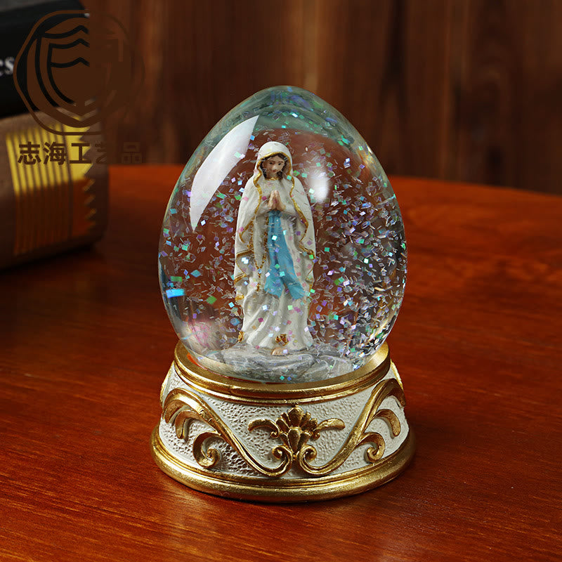 Christianartworkshop Glitzernde Schneekugel in Eiform mit betender Madonna-Statue: Symbol reiner himmlischer Bitte - Unsere Liebe Frau - image 0
