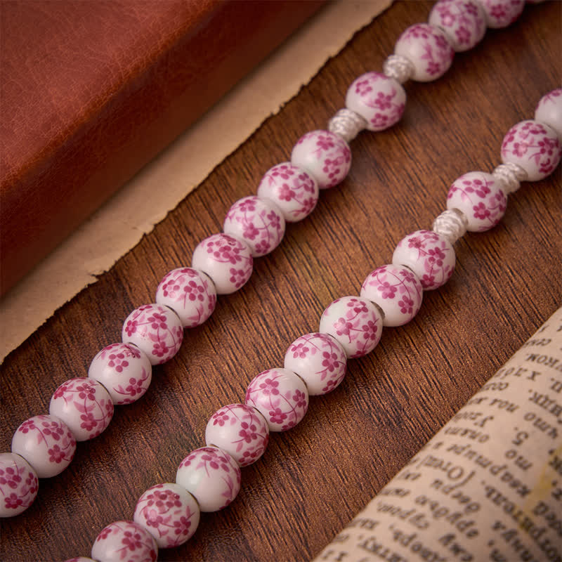 Christianartworkshop Rosenkranz aus rosafarbenen Porzellanperlen mit Blumenmuster und Medaillon Unserer Lieben Frau von Aparecida - image 6